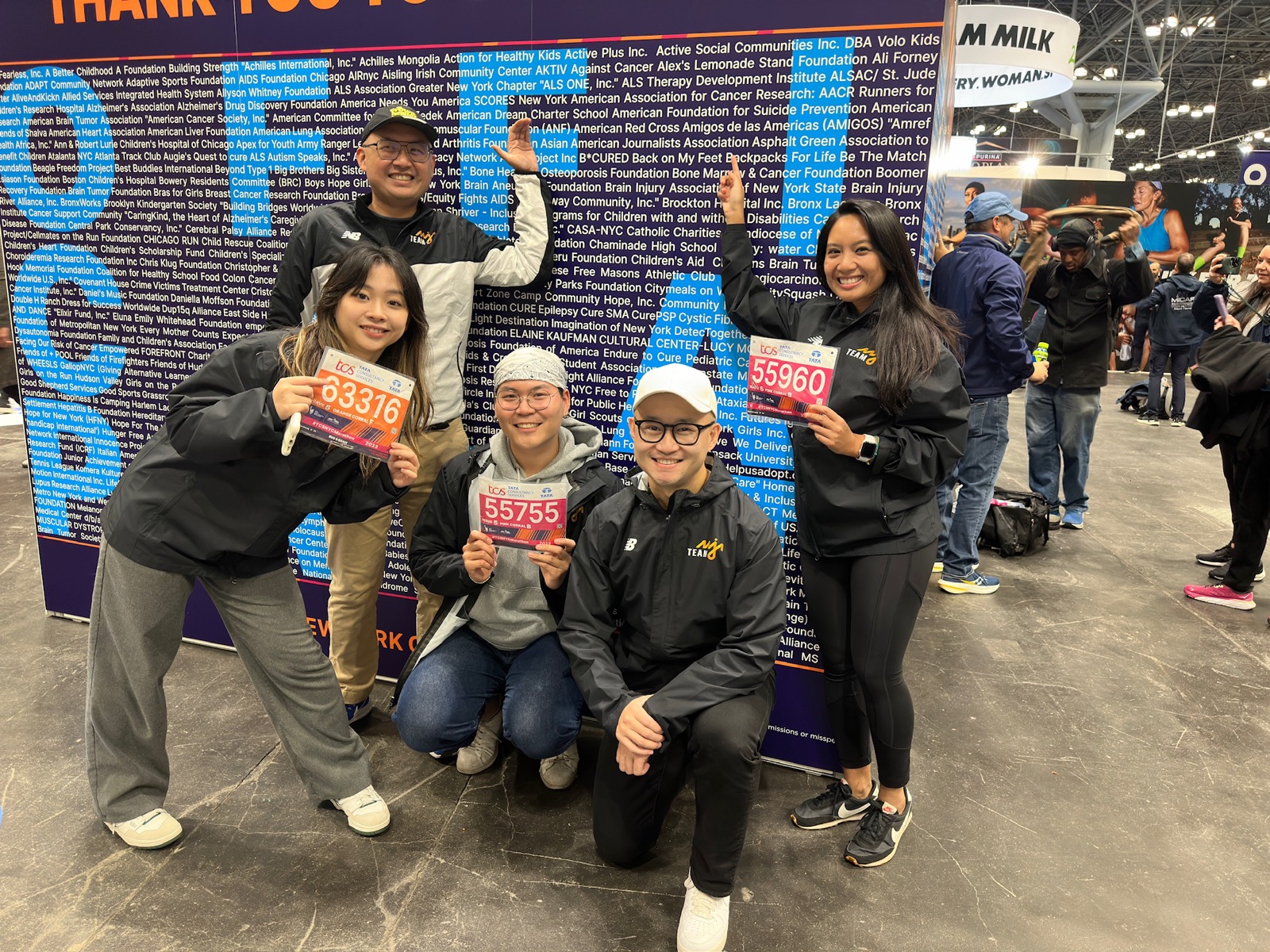 Team AAJA members with race bibs at the NYC Marathon expo